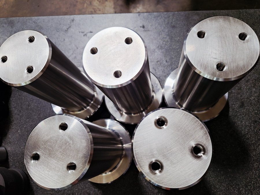 Turned and milled steel standoffs with tapped faces