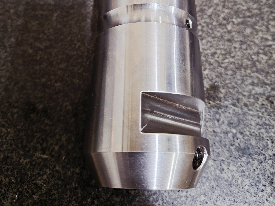 Stepped shaft with a milled keyway and cross-drilled holes